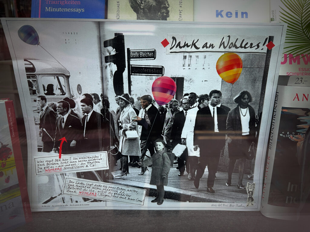 Plakat im Schaufenster der Buchhandlung Dr. Robert Wohlers